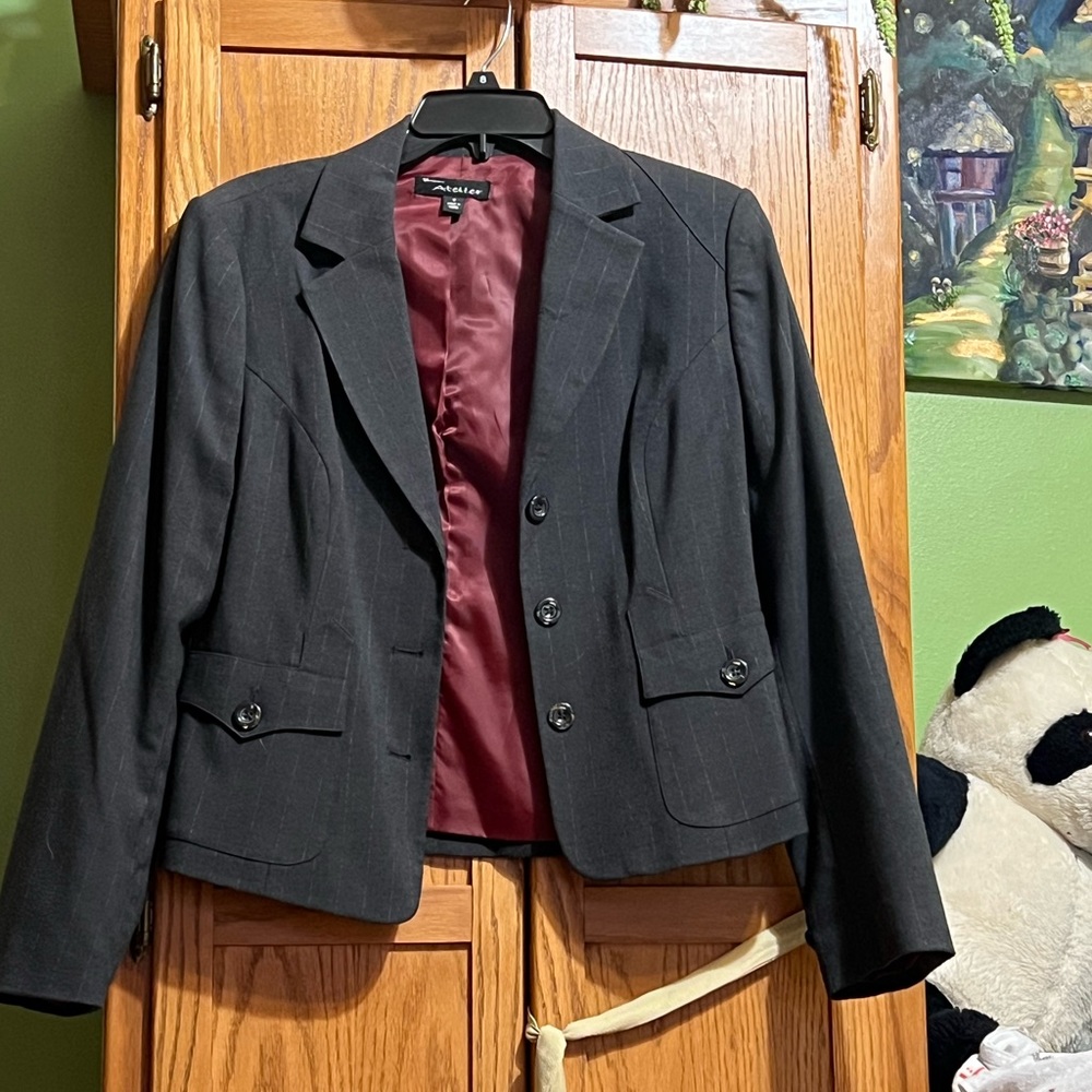 Black suit coat with gray pinstripes